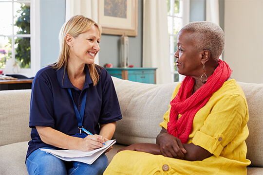 A career in care - carer talking to woman